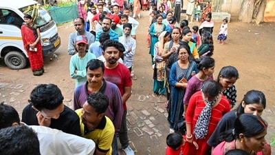 Voters queue up to cast their ballots at a polling station during the third phase voting in India's general election, in Guwahati on May 7, 2024. (Photo by Biju BORO / AFP) (AFP)