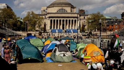 Protesters lay a banner on the sidewalk outside the Fashion Institute of Technology, Friday, April 26, 2024, in New York. As the death toll mounts in the war in Gaza and the humanitarian crisis worsens, protesters at universities across the country are demanding schools cut financial ties to Israel and divest from companies they say are enabling the conflict. (AP Photo/Karen Matthews) (AP) Protesters lay a banner on the sidewalk outside the Fashion Institute of Technology, Friday, April 26, 2024, in New York. As the death toll mounts in the war in Gaza and the humanitarian crisis worsens, protesters at universities across the country are demanding schools cut financial ties to Israel and divest from companies they say are enabling the conflict. (AP Photo/Karen Matthews) (AP)