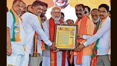 PM Narendra Modi being felicitated by BJP members during an election rally in Karimnagar district of Telangana on Wednesday. (ANI) PM Narendra Modi being felicitated by BJP members during an election rally in Karimnagar district of Telangana on Wednesday. (ANI)