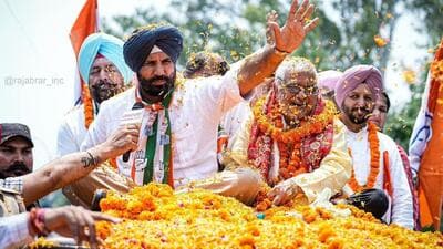 Punjab Pradesh Congress Committee chief Amarinder Singh Raja Warring and Patiala candidate Dharamvira Gandhi holding a roadshow on Wednesday. (HT Photo) Punjab Pradesh Congress Committee chief Amarinder Singh Raja Warring and Patiala candidate Dharamvira Gandhi holding a roadshow on Wednesday. (HT Photo)