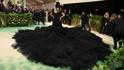 Cardi B's Voluminous Skirt: Cardi B made a grand entrance with a gargantuan skirt that engulfed the Met Gala steps, creating a dramatic and unforgettable fashion moment that captured everyone's attention. (AFP) Cardi B's Voluminous Skirt: Cardi B made a grand entrance with a gargantuan skirt that engulfed the Met Gala steps, creating a dramatic and unforgettable fashion moment that captured everyone's attention. (AFP)