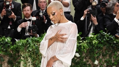 Doja Cat's Wet T-Shirt Dress: Doja Cat turned heads with a daring wet T-shirt dress by Vetements, transforming the red carpet into a fashionable wet T-shirt contest with her edgy makeup and unconventional yet striking ensemble. (AFP) Doja Cat's Wet T-Shirt Dress: Doja Cat turned heads with a daring wet T-shirt dress by Vetements, transforming the red carpet into a fashionable wet T-shirt contest with her edgy makeup and unconventional yet striking ensemble. (AFP)