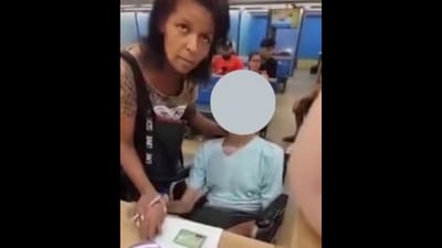 The woman held her uncle's hand to sign off the documents to get loan in her name. (x/@RestrictedVids) The woman held her uncle's hand to sign off the documents to get loan in her name. (x/@RestrictedVids)