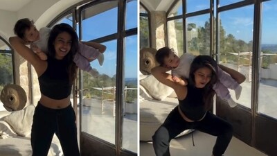 Priyanka Chopra was seen doing squats while carrying her daughter on her arms. Priyanka Chopra was seen doing squats while carrying her daughter on her arms.