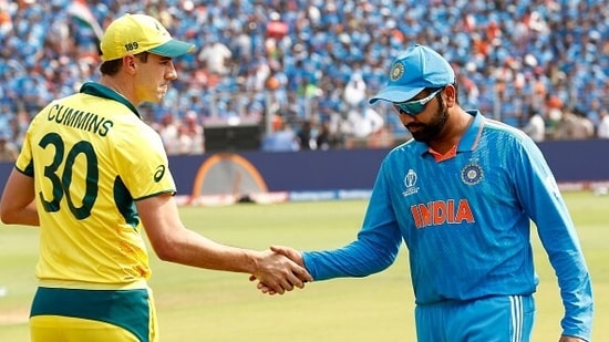 Pat Cummins (L) and Rohit Sharma after the World Cup final toss (Getty)
