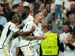 Real Madrid's Joselu, right, celebrates with his teammates after scoring his side's opening goal during the Champions League semifinal Real Madrid's Joselu, right, celebrates with his teammates after scoring his side's opening goal during the Champions League semifinal