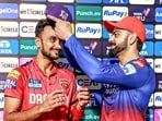 Punjab Kings' Harshal Patel receives the IPL Purple Cap from Royal Challengers Bengaluru's Virat Kohli Punjab Kings' Harshal Patel receives the IPL Purple Cap from Royal Challengers Bengaluru's Virat Kohli