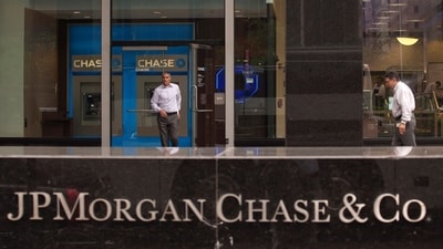 A customer exits the lobby of JPMorgan Chase & Co. headquarters in New York. (Reuters)