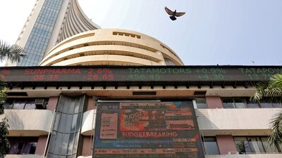 Stock market today: A bird flies past a screen displaying the Sensex results on the facade of the Bombay Stock Exchange (BSE) building in Mumbai. (Reuters)