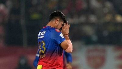 Karn then took the wicket of Jitesh Sharma and thus put the breaks on RCB's scoring rate. (AP) Karn then took the wicket of Jitesh Sharma and thus put the breaks on RCB's scoring rate. (AP)