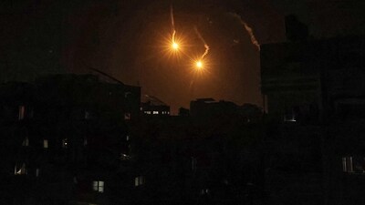 Flares are fired above Rafah in the southern Gaza Strip on May 7, 2024 amid the ongoing conflict in the Palestinian territory between Israel and the militant group Hamas. (Photo by AFP) (AFP) Flares are fired above Rafah in the southern Gaza Strip on May 7, 2024 amid the ongoing conflict in the Palestinian territory between Israel and the militant group Hamas. (Photo by AFP) (AFP)