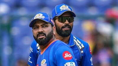 Mumbai Indians captain Hardik Pandya and his teammate Rohit Sharma during the Indian Premier League (IPL) T20 cricket match between Delhi Capitals and Mumbai Indians (PTI)