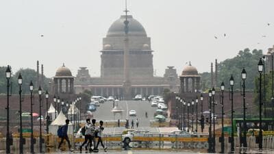 People walk past Kartavya Path on a hot summer day in New Delhi. (ANI Photo) People walk past Kartavya Path on a hot summer day in New Delhi. (ANI Photo)