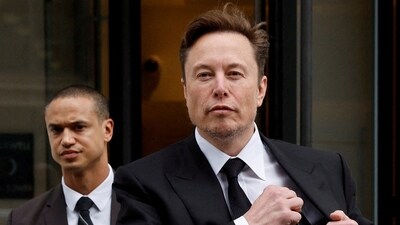Tesla CEO Elon Musk and his security detail depart the company's local office in Washington, US. (Reuters)