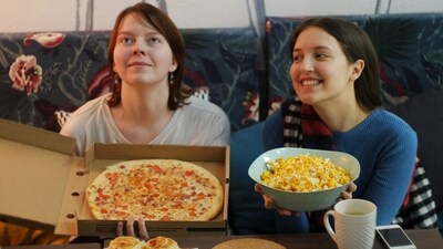 Hop on a Movie Marathon: Snuggle up on the couch with some popcorn and indulge in a movie marathon featuring your favorite films or TV shows. Whether you're into classic rom-com, thrillers, or heartwarming dramas, choose a selection of movies that you both love and enjoy a cozy day of binge-watching together. (Unsplash)