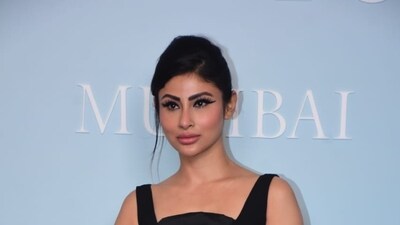 Mouni Roy turned up in a black dress and paired it with a sleek updo. Mouni is known for her debut with Kyuki Saas Bhi Kabhi Bahu Thi and for playing the lead in the first season of Naagin. Mouni Roy turned up in a black dress and paired it with a sleek updo. Mouni is known for her debut with Kyuki Saas Bhi Kabhi Bahu Thi and for playing the lead in the first season of Naagin.