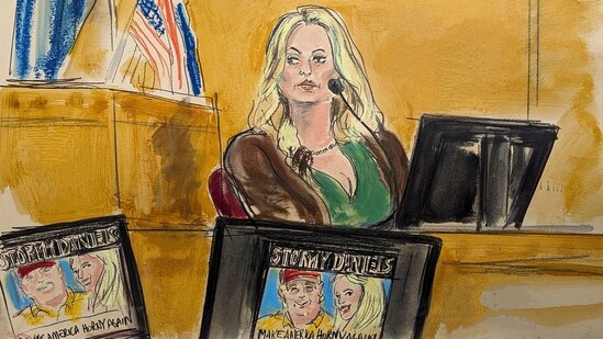 Stormy Daniels testifies on the witness stand as a promotional image for one of her shows featuring an image of Trump is displayed on monitors in Manhattan criminal court, Thursday, May 9, 2024, in New York. (Elizabeth Williams via AP) (AP)