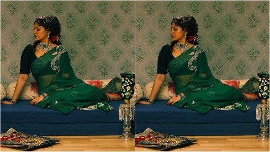 Her stunning saree came in a captivating shade of dark green and had intricate sequin embroidery on the shoulders, she had it draped elegantly around her, leaving the pallu falling beautifully from the shoulders.  She looks very beautiful with a black velvet V-neck blouse. (Instagram/@aslisona)
