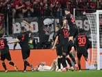 Leverkusen's players celebrate after Roma's Italian defender #23 Gianluca Mancini scored an own goal during the UEFA Europa League semi final
