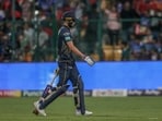 Gujarat Titans' captain Shubman Gill walks off the field after losing his wicket during a match.