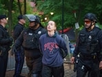 Police detain a protester on the University of Pennsylvania campus, in Philadelphia, on Friday, May 10, 2024.  (Jessica Griffin/The Philadelphia Inquirer via AP)