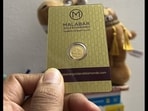 An individual showing a gold coin he ordered from Blinkit on Akshaya Tritiya. An individual showing a gold coin he ordered from Blinkit on Akshaya Tritiya.