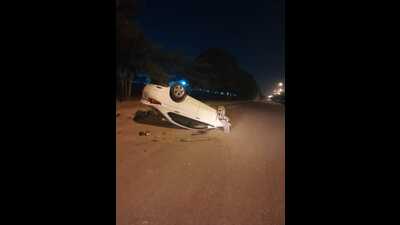 A white Honda City car lost control and rammed into concrete drainage. It then flipped multiple times and came to a halt on its roof in the middle of the road trapping the driver inside, on the Bhangrola-Pataudi road near Bhangrola in Manesar. (HT PHOTO.) A white Honda City car lost control and rammed into concrete drainage. It then flipped multiple times and came to a halt on its roof in the middle of the road trapping the driver inside, on the Bhangrola-Pataudi road near Bhangrola in Manesar. (HT PHOTO.)