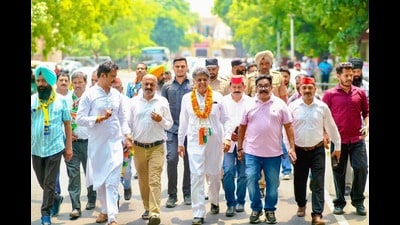 Chandigarh Congress candidate Manish Tewari during a foot march in Sector 46 on Friday. (HT Photo)