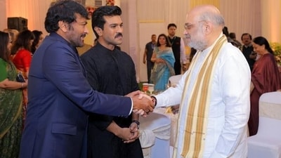 Chiranjeevi and Ram Charan greet Amit Shah at Padma awards. Chiranjeevi and Ram Charan greet Amit Shah at Padma awards.
