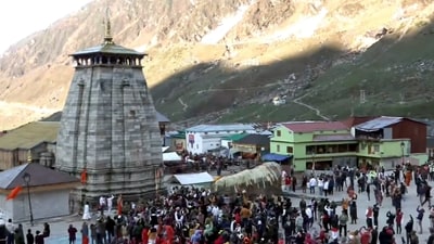 Devotees arrive to offer prayers at the Kedarnath Temple after its portals opened, (PTI) Devotees arrive to offer prayers at the Kedarnath Temple after its portals opened, (PTI)