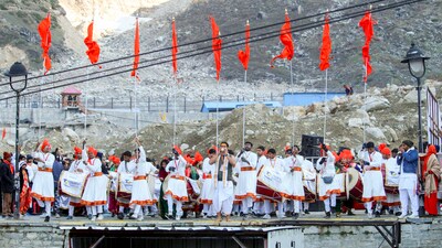 Artists perform during the opening of the portals of the Kedarnath Temple for devotees. Approximately 10,000 devotees witnessed the of the portals of the Himalayan temple. (PTI)