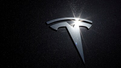 Tesla layoffs: The Tesla logo is seen on a car in Los Angeles, California,. (Reuters)