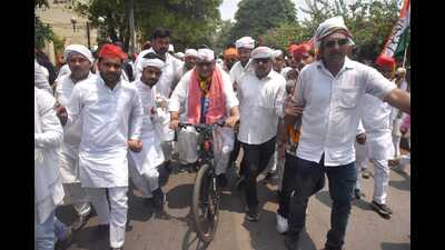 UPCC chief Ajay Rai reached collectorate riding a bicycle. (HT photo)