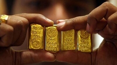 Akshaya Tritiya 2024: A salesman displays gold bars inside a jewellery shop on the occasion of the Akshaya Tritiya festival in Hyderabad. (Reuters) Akshaya Tritiya 2024: A salesman displays gold bars inside a jewellery shop on the occasion of the Akshaya Tritiya festival in Hyderabad. (Reuters)