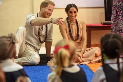 Britain's Prince Harry (L), Duke of Sussex, and Britain's Meghan (R), Duchess of Sussex, meet with children during their visit at the Lightway Academy in Abuja on May 10, 2024 as they visit Nigeria as part of celebrations of Invictus Games anniversary. (Photo by Kola SULAIMON / AFP) (AFP) Britain's Prince Harry (L), Duke of Sussex, and Britain's Meghan (R), Duchess of Sussex, meet with children during their visit at the Lightway Academy in Abuja on May 10, 2024 as they visit Nigeria as part of celebrations of Invictus Games anniversary. (Photo by Kola SULAIMON / AFP) (AFP)
