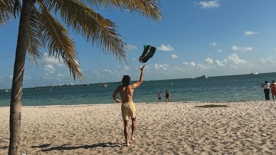 He’s busy running on the beach with abandon while going shirtless in the Florida sun.