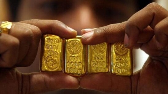 Akshaya Tritiya 2024: A salesman displays gold bars inside a jewellery shop on the occasion of the Akshaya Tritiya festival in Hyderabad. (Reuters)