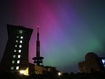 Northern lights appear in the night sky above the Brocken early Saturday, May 11, 2024, in Schierke, northern Germany. (Matthias Bein/dpa via AP)
