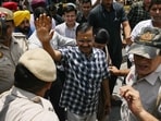 Arvind Kejriwal (C), chief minister of the capital Delhi and leader of the Aam Aadmi Party (AAP), waves to supporters during a visit to Hanuman Temple. (AFP)