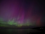 Gloucester, Massachusetts, United States: The aurora borealis, or northern lights, illuminate the sky over the ocean on May 10, 2024. REUTERS/Brian Snyder