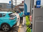 A taxi driver prepares to charge his VinFast Auto Ltd. electric vehicle VF e34 model at a charging station outside a company's showroom. Photographer: Linh Pham/Bloomberg A taxi driver prepares to charge his VinFast Auto Ltd. electric vehicle VF e34 model at a charging station outside a company's showroom. Photographer: Linh Pham/Bloomberg