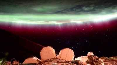 From the International Space Station, NASA astronaut Scott Kelly captures rare footage of dazzling red auroras caused by a severe solar storm. These auroras, also known as the northern lights, occur when charged particles from the sun interact with the Earth's atmosphere. From the International Space Station, NASA astronaut Scott Kelly captures rare footage of dazzling red auroras caused by a severe solar storm. These auroras, also known as the northern lights, occur when charged particles from the sun interact with the Earth's atmosphere.