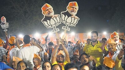 BJP supporters during a rally for the party’s West Delhi candidate Kamaljeet Seharawat at Durga Park Ramleela Ground in New Delhi on Saturday. (HT PHOTO.)