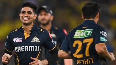 Gujarat Titans' captain Shubman Gill (L) and teammate Mohit Sharma celebrate a wicket. (AFP) Gujarat Titans' captain Shubman Gill (L) and teammate Mohit Sharma celebrate a wicket. (AFP)