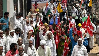 Carrying posters of police action on farmers, women wrestlers, sarpanches and Asha workers, the protesters took out a tractor march, led by farmer leader Raju Mann and other khap leaders, through several villages of Badhra assembly segment of Charkhi Dadri on Saturday. (HT Photo)