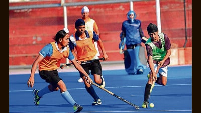 Hockey players in action during a match at PAU in Ludhiana on Saturday. (Manish/HT)