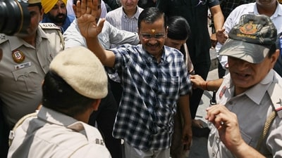 Arvind Kejriwal (C), chief minister of the capital Delhi and leader of the Aam Aadmi Party (AAP), waves to supporters during a visit to Hanuman Temple. (AFP) Arvind Kejriwal (C), chief minister of the capital Delhi and leader of the Aam Aadmi Party (AAP), waves to supporters during a visit to Hanuman Temple. (AFP)