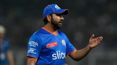 Mumbai Indians' Rohit Sharma gestures as he stands in the field before the start of the Indian Premier League cricket match between Kolkata Knight Riders and Mumbai Indians in Kolkata, India, Saturday (AP)