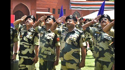 Officials during the installation ceremony of 350 feet high flag of the Border Security Force in Attari, Amritsar, on Saturday. (Sameer Sehgal/HT)