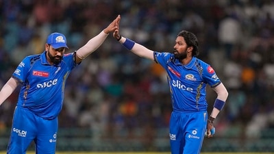 Mumbai Indians captain Hardik Pandya with teammate Rohit Sharma celebrate a wicket. (PTI) Mumbai Indians captain Hardik Pandya with teammate Rohit Sharma celebrate a wicket. (PTI)